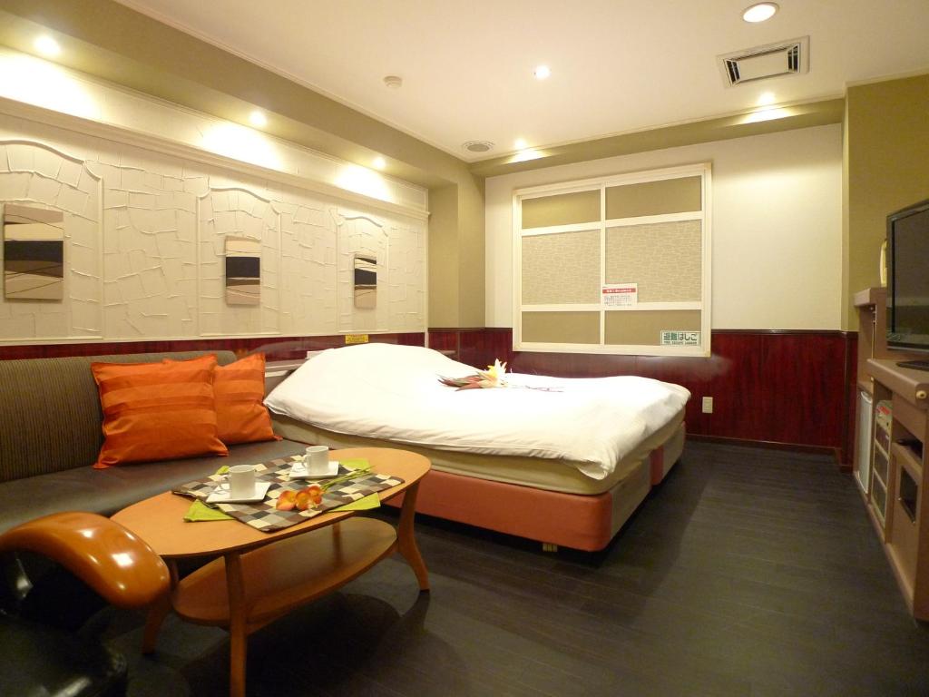 Postel nebo postele na pokoji v ubytování Hotel GOLF Hodogaya (Adult Only)