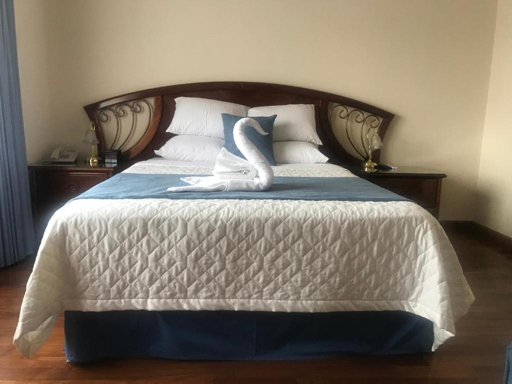 Posteľ alebo postele v izbe v ubytovaní Hotel Belvedere