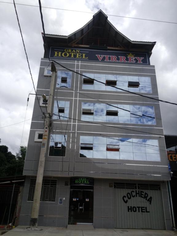 a building with a sign on the front of it at Gran Hotel Virrey in San Ramón