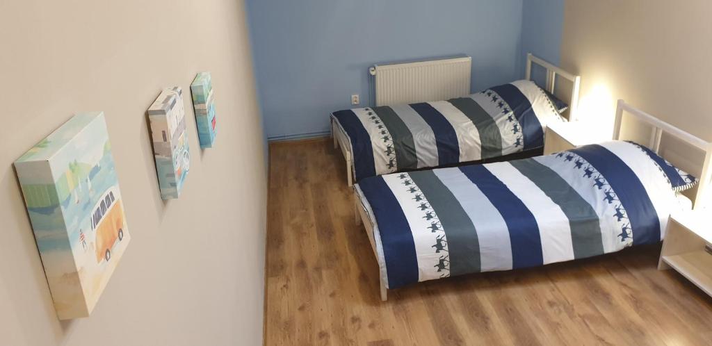 Postel nebo postele na pokoji v ubytování Smart Stay Hostel Gdynia