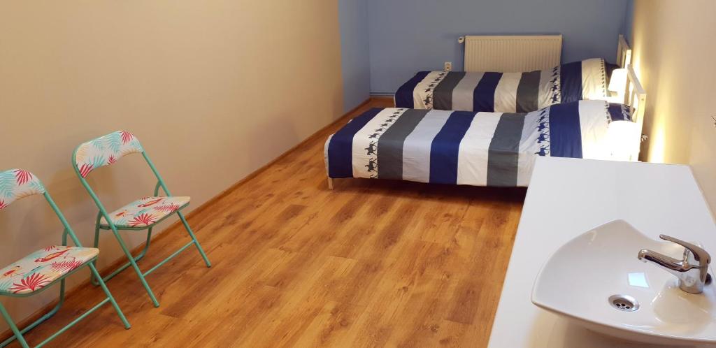 Postel nebo postele na pokoji v ubytování Smart Stay Hostel Gdynia