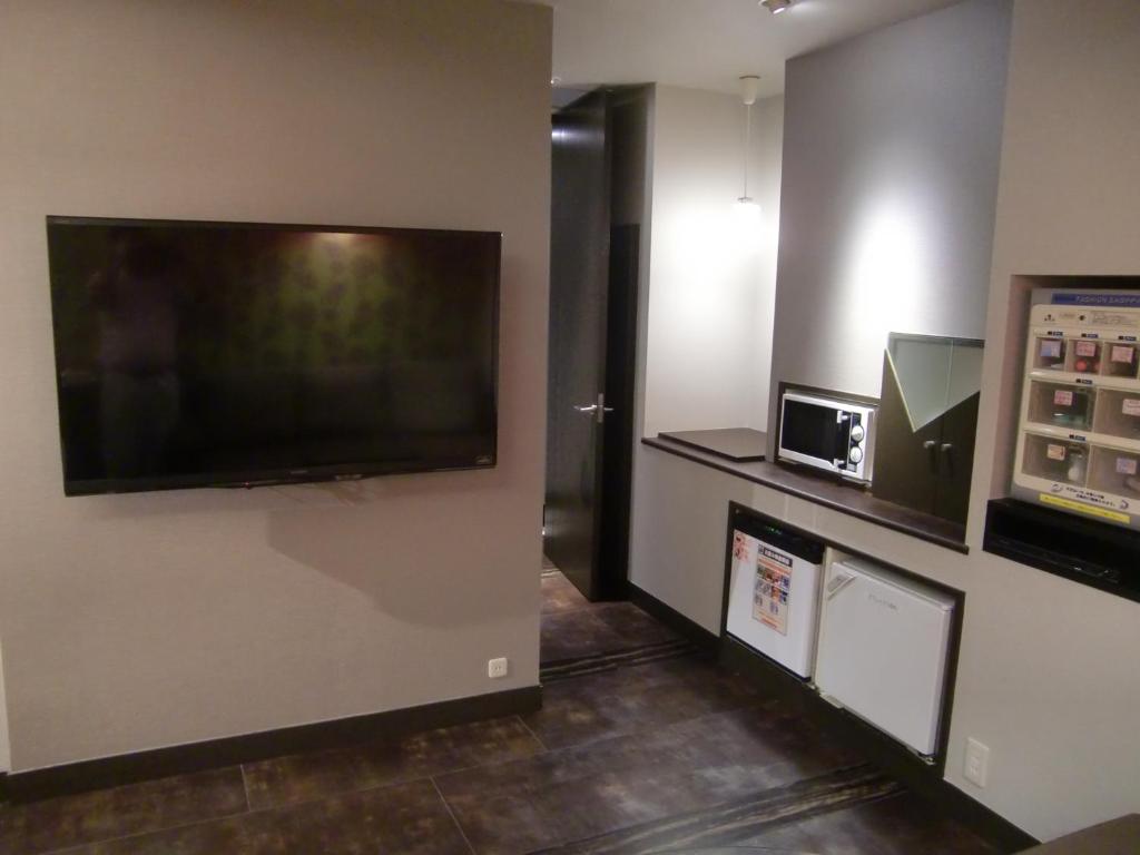 TV a/nebo společenská místnost v ubytování Hotel GOLF Nirasaki (Adult Only)