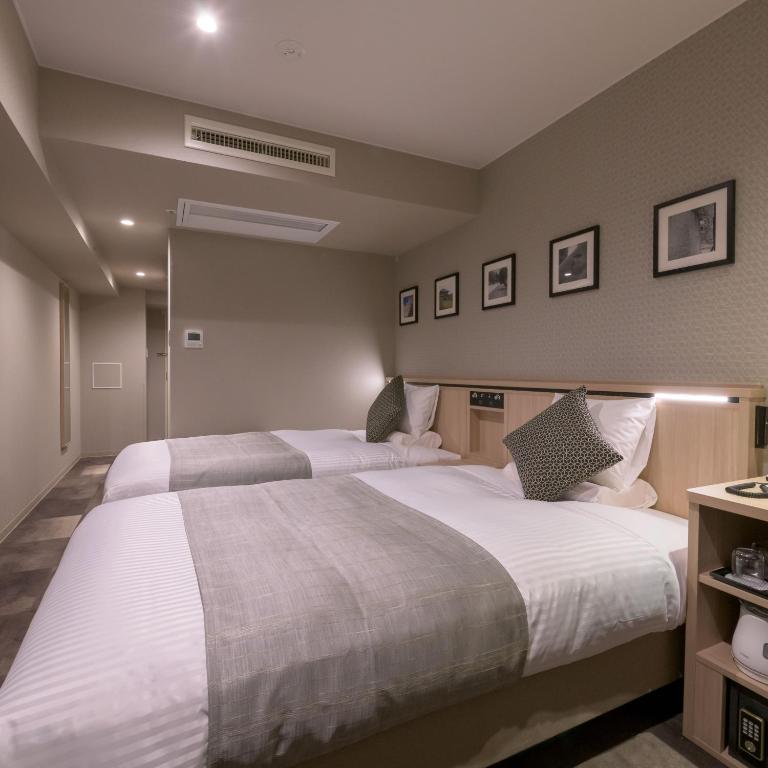 Postel nebo postele na pokoji v ubytování Nara Royal Hotel