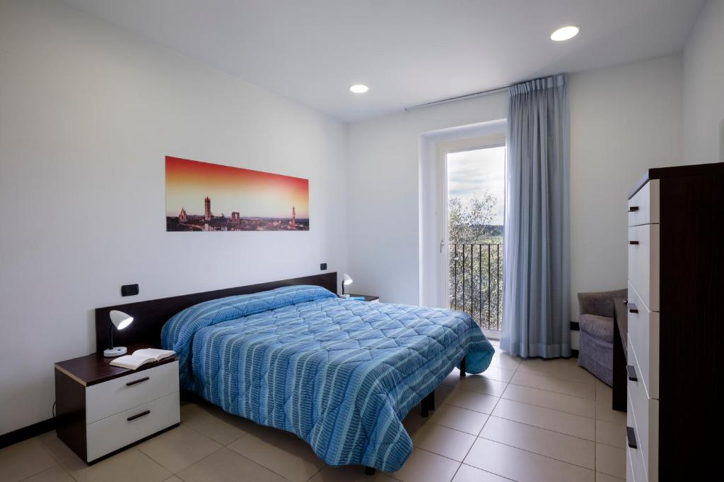 Posteľ alebo postele v izbe v ubytovaní Porta Pispini Residence