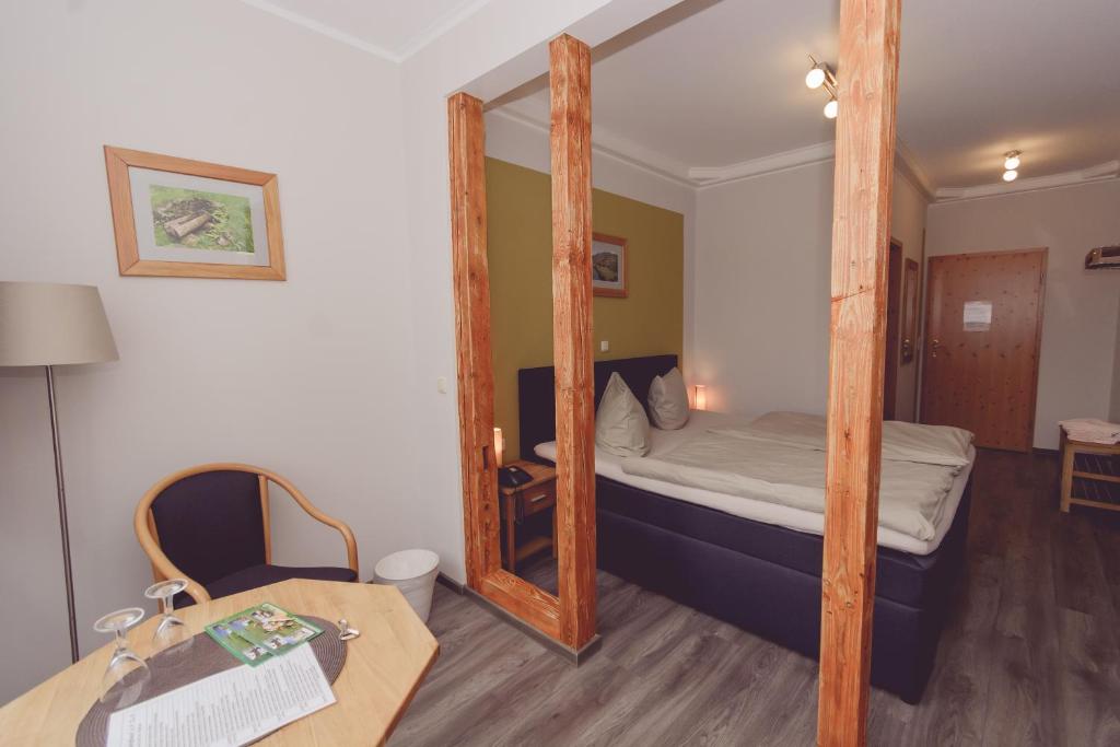 Postel nebo postele na pokoji v ubytování Hotel und Berggasthof Spießberghaus