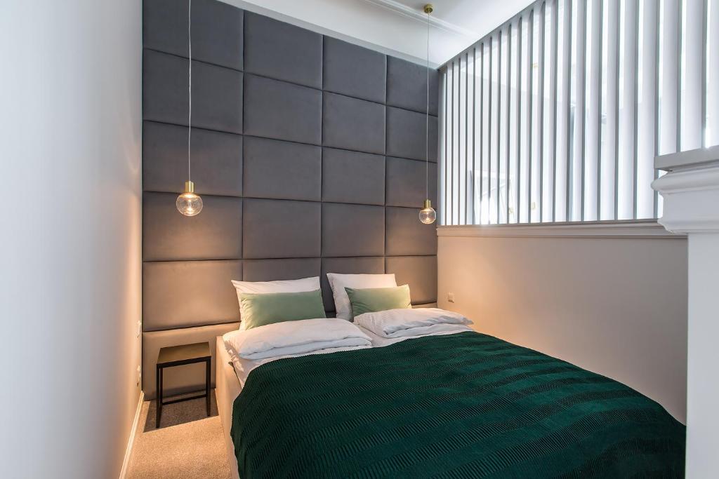 Posteľ alebo postele v izbe v ubytovaní Homewell Boutique Apartments