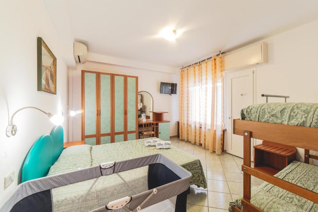 Postel nebo postele na pokoji v ubytování Blu Star Hotel