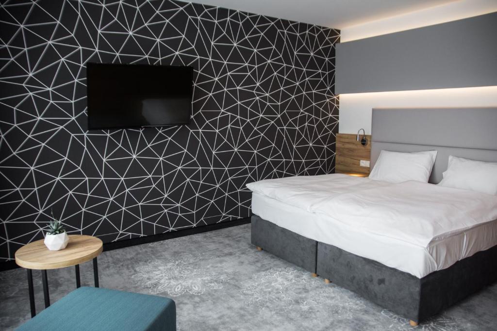 Postel nebo postele na pokoji v ubytování Hotel Limanova
