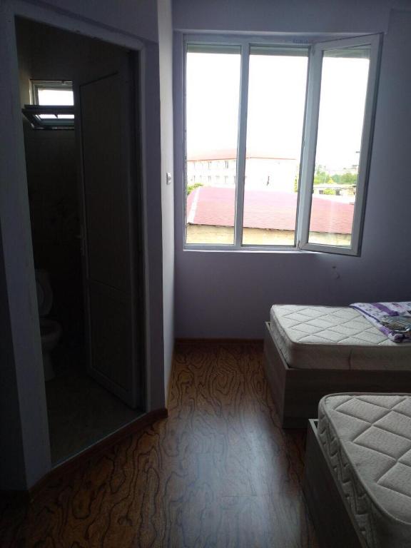 Postel nebo postele na pokoji v ubytování Guest House Kakha
