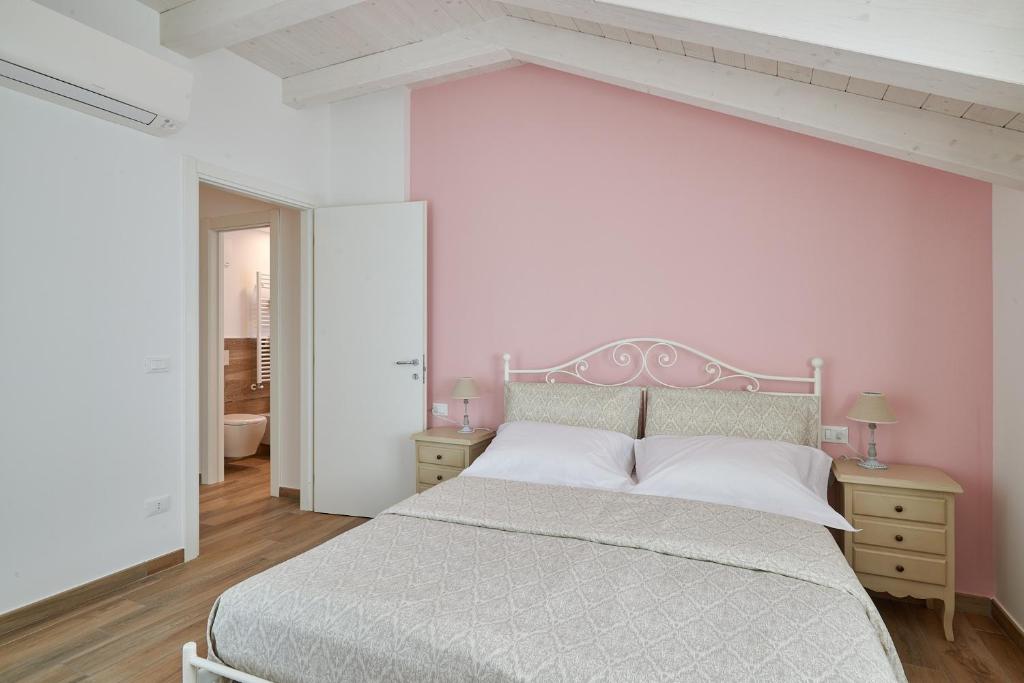 Postel nebo postele na pokoji v ubytování Agriturismo Casastella