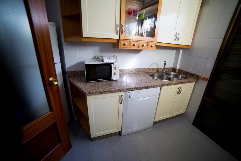 Kuchyň nebo kuchyňský kout v ubytování Casa junto a palacio de VIANA