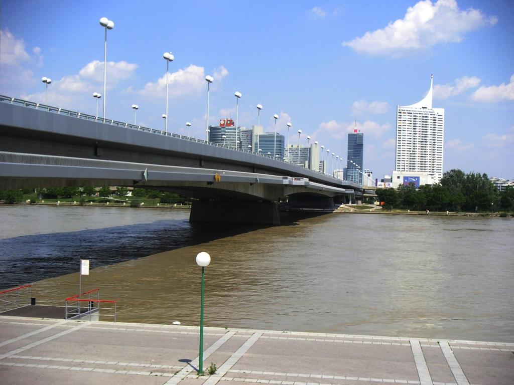 a bridge over a river next to a city at Freinest Wien in Vienna