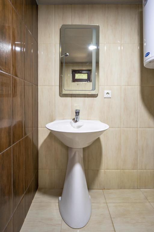 Koupelna v ubytování Guesthouse David Zhorzholiani