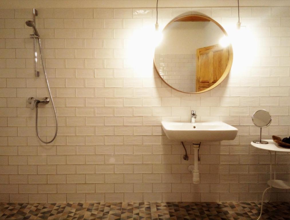 a bathroom with a sink and a mirror at Füveskert in Erdőbénye