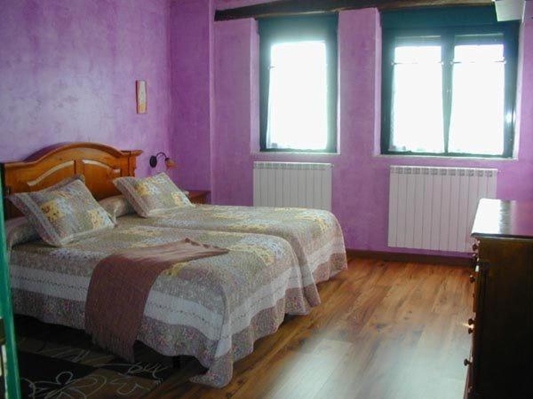 Postel nebo postele na pokoji v ubytování Hostería Casa Flor