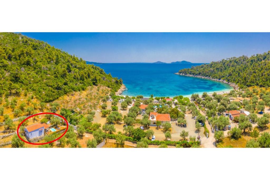 an aerial view of a house on a beach at Neptune in Alonnisos