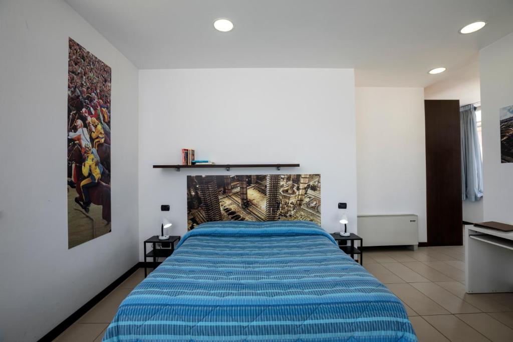 Posteľ alebo postele v izbe v ubytovaní Porta Pispini Residence