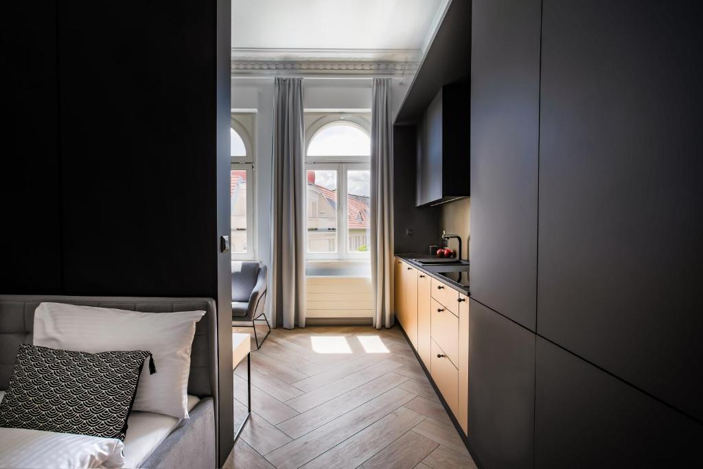 Televízia a/alebo spoločenská miestnosť v ubytovaní Homewell Boutique Apartments