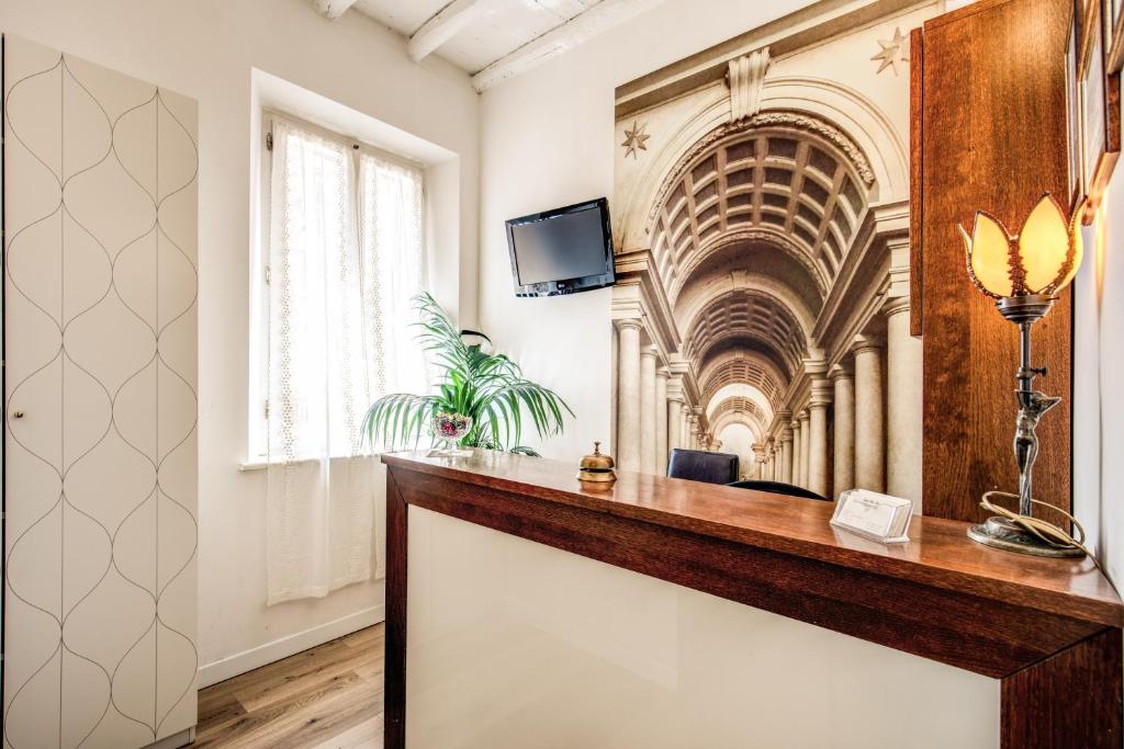 a room with a reception desk in a building at Magenta Deluxe Cancello in Rome