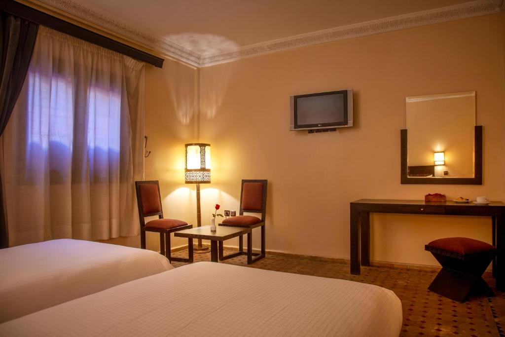 Postel nebo postele na pokoji v ubytování Riad Marrakech By Hivernage