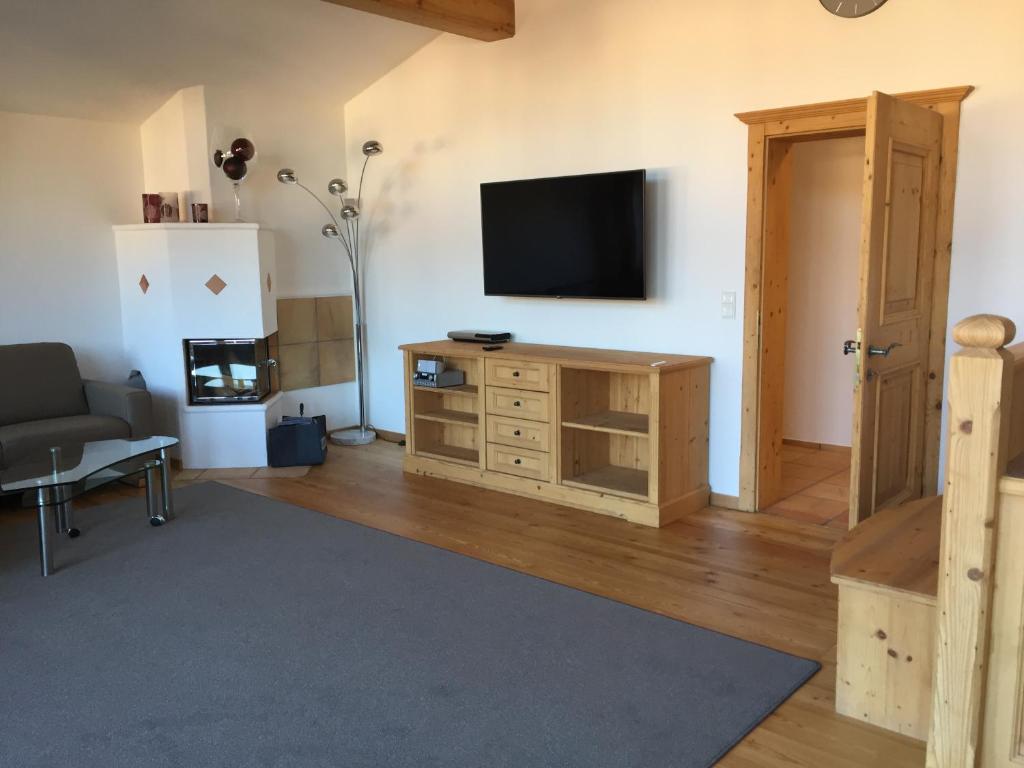 Televízia a/alebo spoločenská miestnosť v ubytovaní Penthouse Appartement