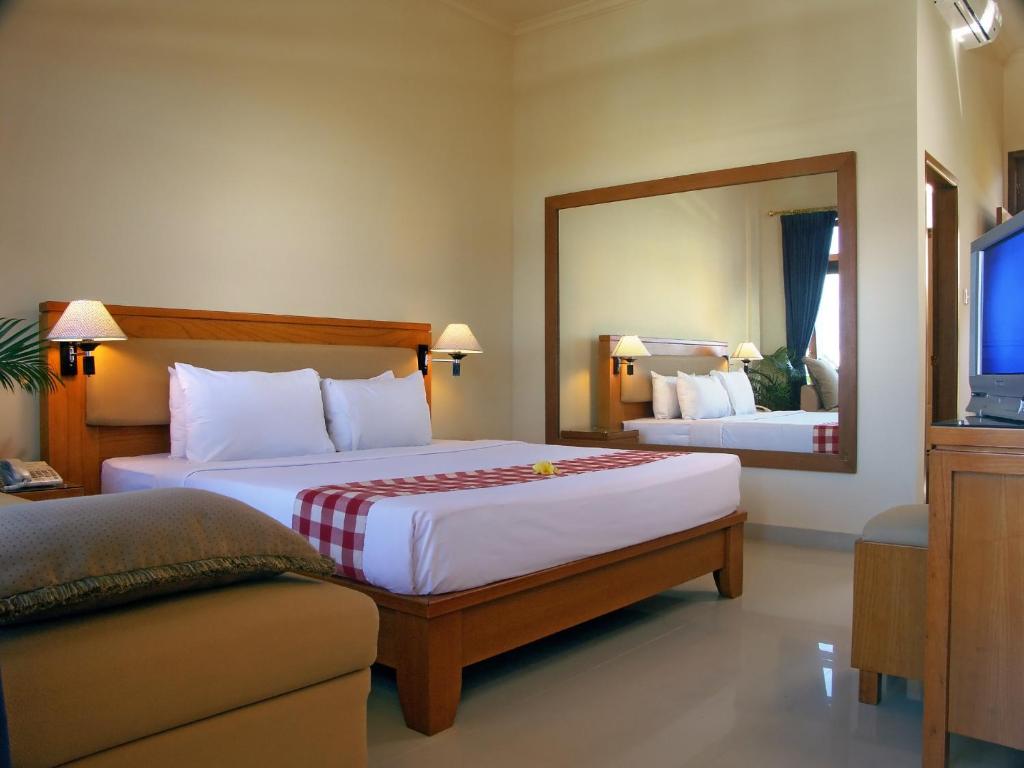 Postel nebo postele na pokoji v ubytování Febri's Hotel & Spa