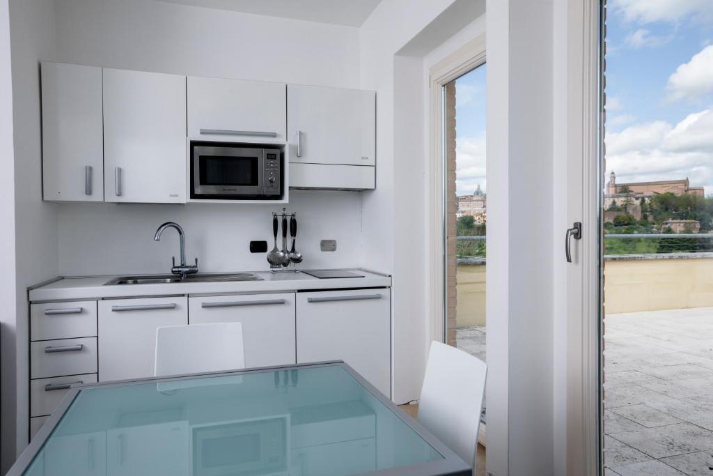 Kuchyňa alebo kuchynka v ubytovaní Porta Pispini Residence