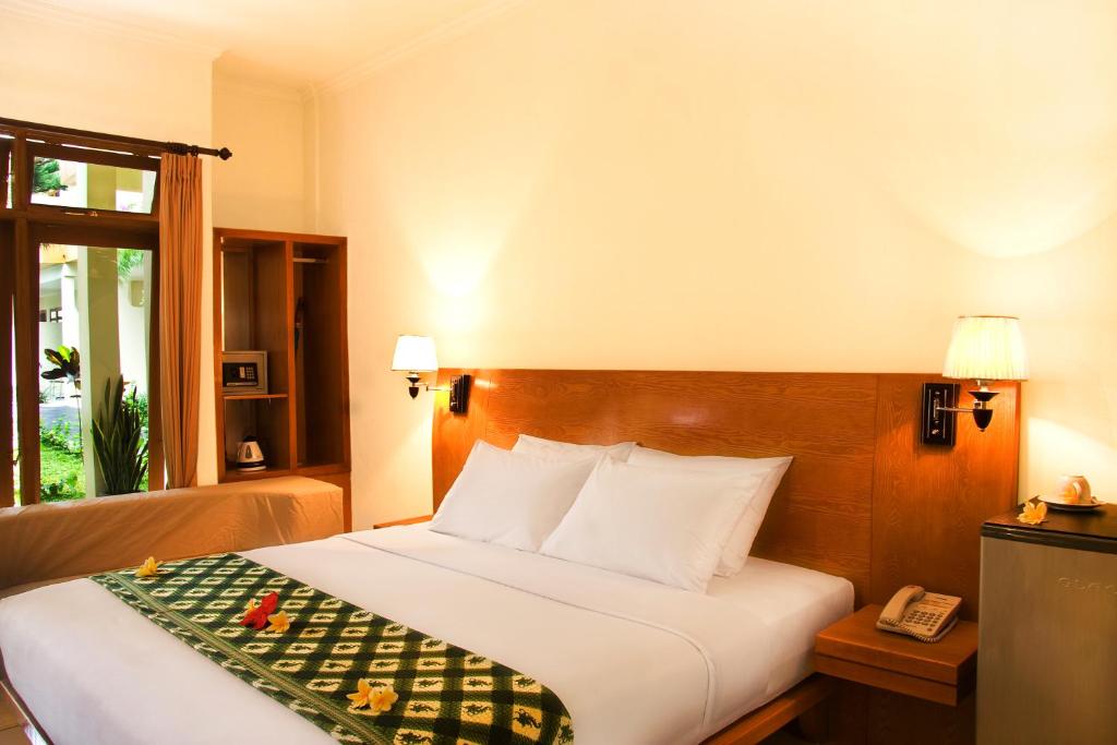 Postel nebo postele na pokoji v ubytování Febri's Hotel & Spa