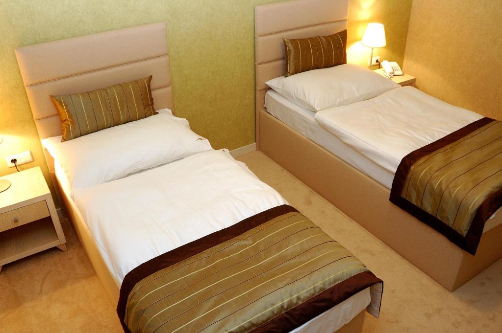 Postel nebo postele na pokoji v ubytování Hotel Predium
