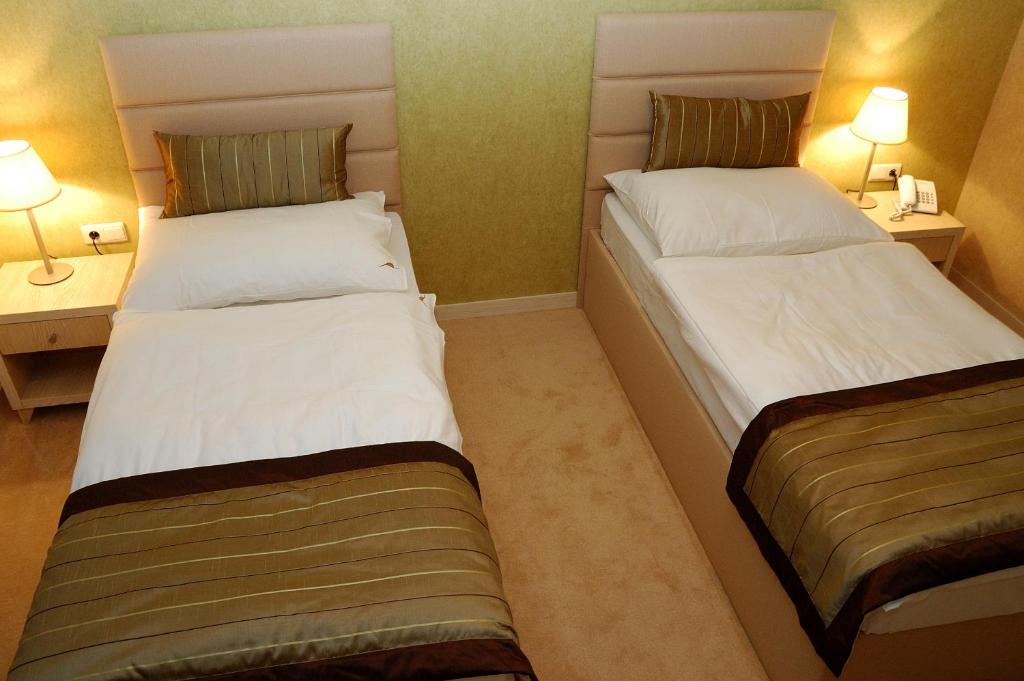 Postel nebo postele na pokoji v ubytování Hotel Predium