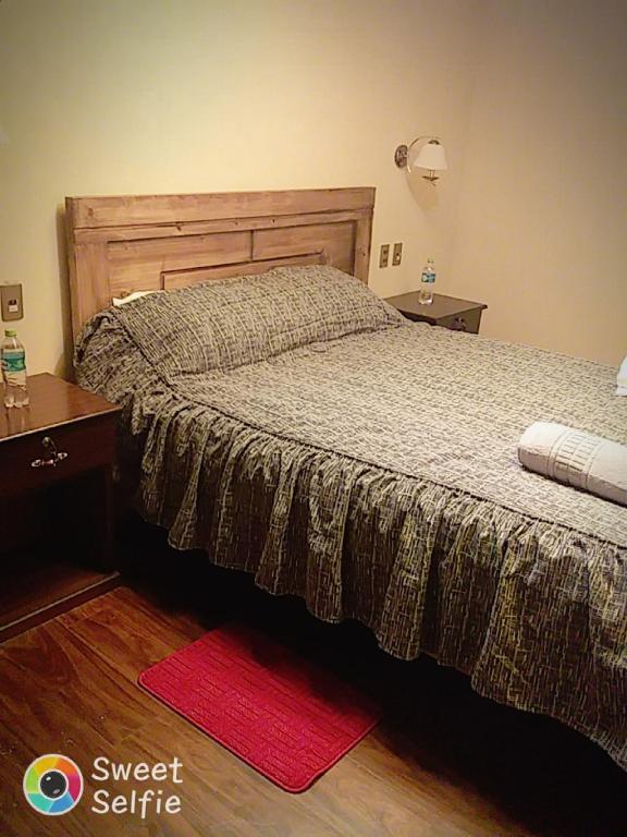 Postel nebo postele na pokoji v ubytování Hostal Nichkito