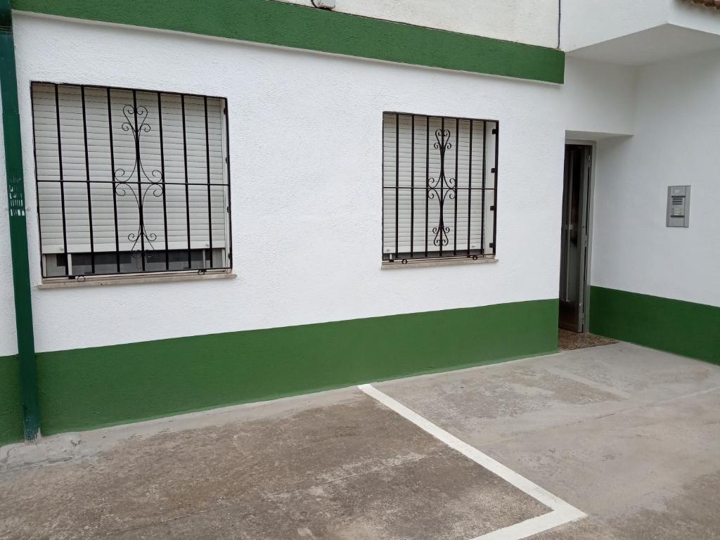 two windows on the side of a building at Urbanización la barca in Oropesa del Mar