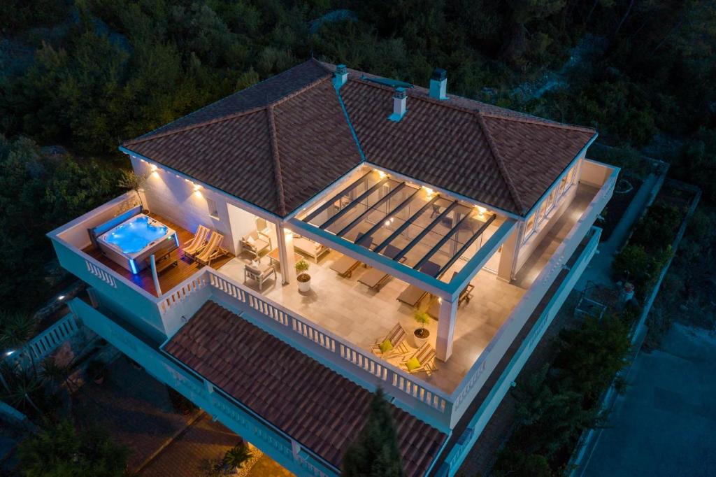 an aerial view of a house with a swimming pool at Secret Escape Penthouse in Slatine
