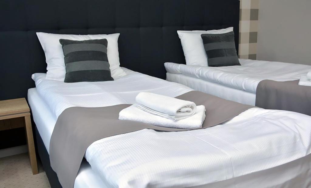 Posteľ alebo postele v izbe v ubytovaní Hotelik 51