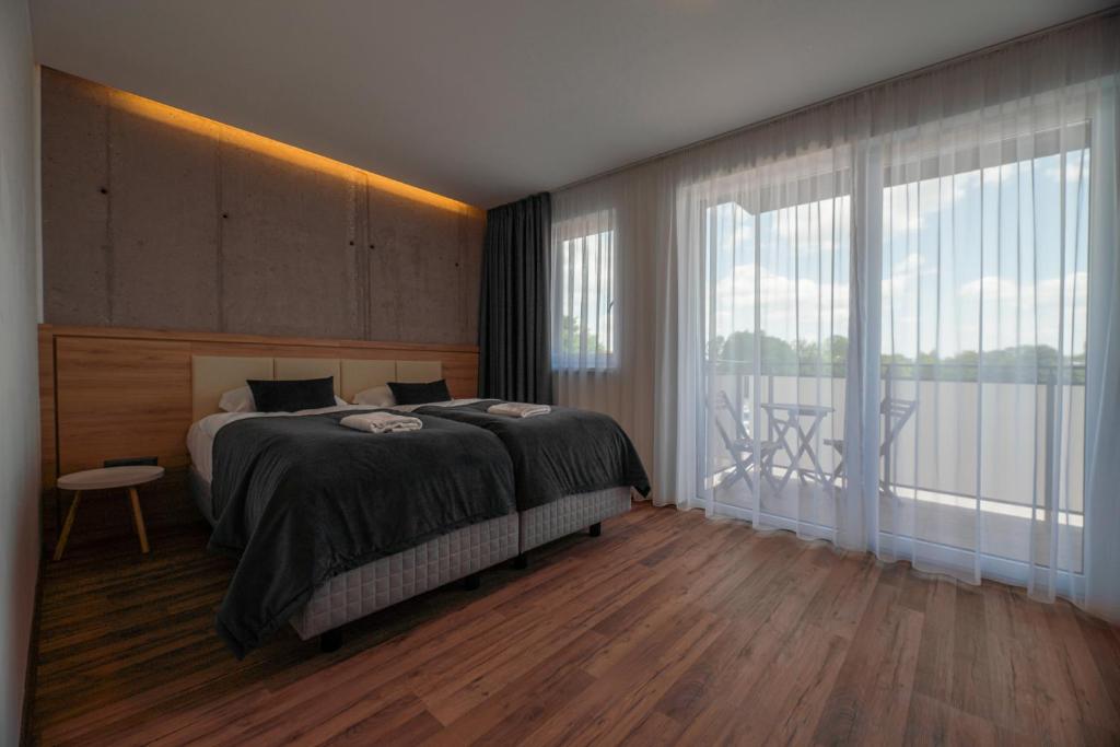 Postel nebo postele na pokoji v ubytování Apartmány pri vstupe do Aquaparku