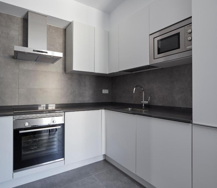 Kuchyňa alebo kuchynka v ubytovaní Muinoa 5 by FeelFree Rentals
