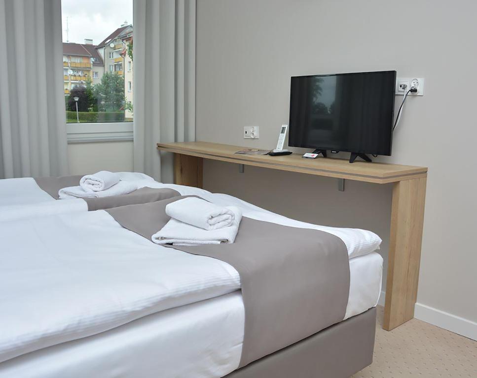 Posteľ alebo postele v izbe v ubytovaní Hotelik 51