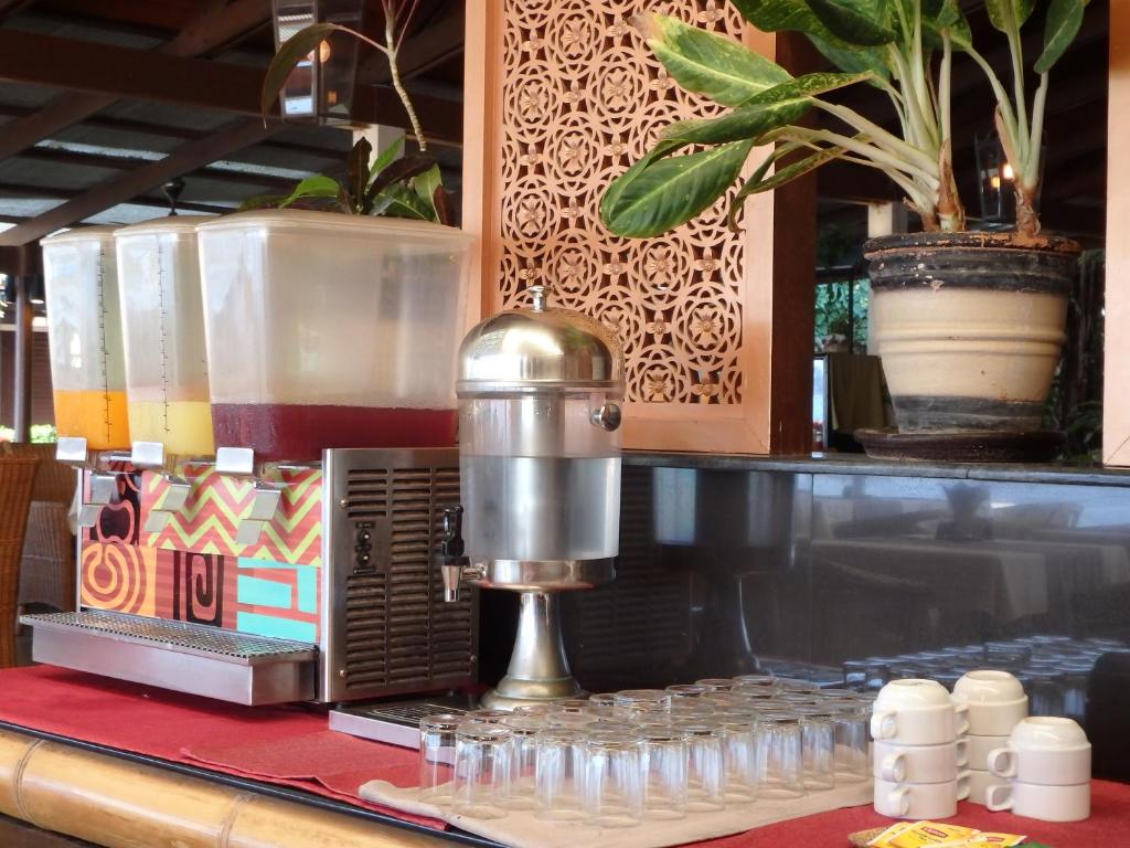 a coffee machine sitting on top of a counter at Montien House - SHA Plus in Chaweng