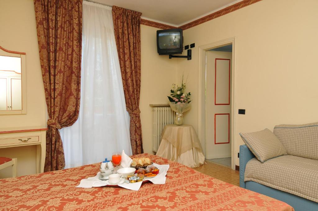 TV a/nebo společenská místnost v ubytování La Quiete Park Hotel