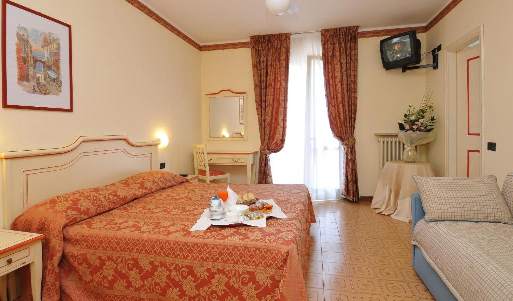 Postel nebo postele na pokoji v ubytování La Quiete Park Hotel