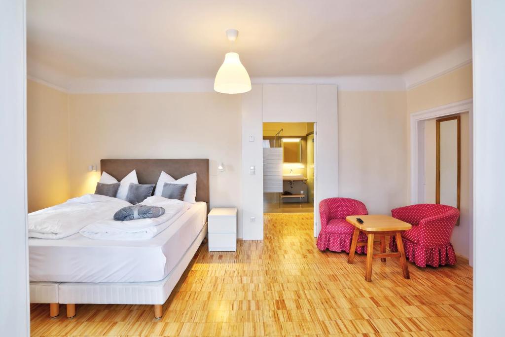 Postel nebo postele na pokoji v ubytování Stylische Cityapartments Benedikt