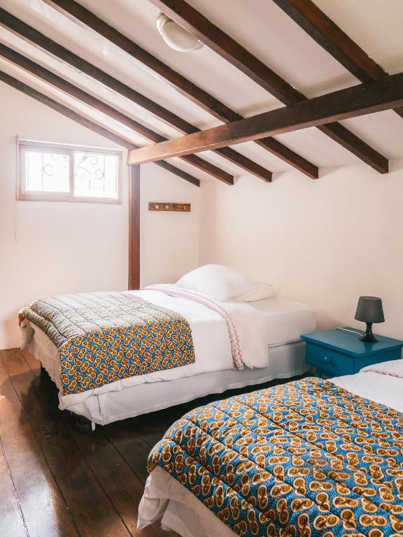Postel nebo postele na pokoji v ubytování Iguanazu Bed & Breakfast