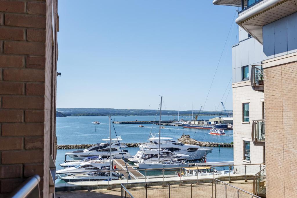 a group of boats are docked at a marina at Marina Secret in Poole