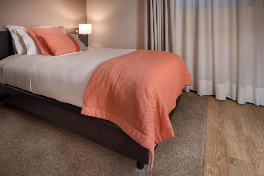 Postel nebo postele na pokoji v ubytování TURIM Aveiro Palace Hotel