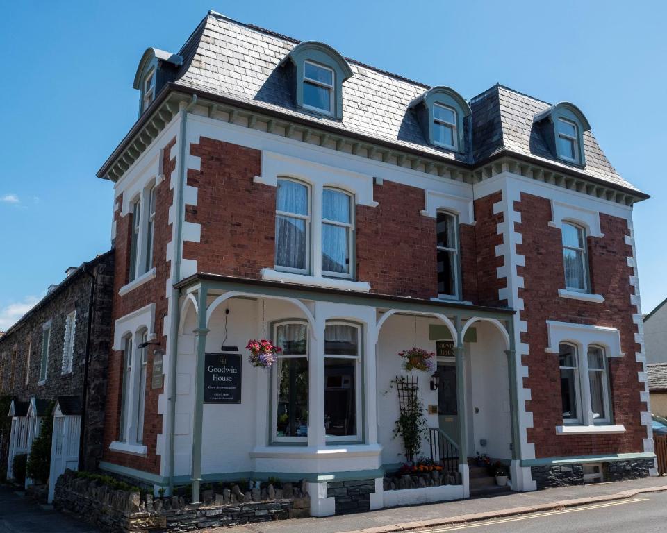 a red and white brick building on a street at Goodwin House in Keswick