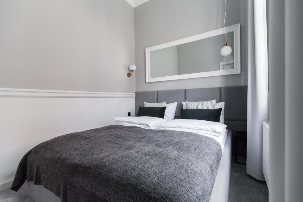 Posteľ alebo postele v izbe v ubytovaní Homewell Boutique Apartments