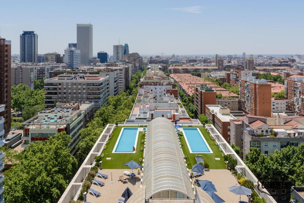 an overhead view of a city with a large building at Charming Eurobuilding 2 Luxury in Madrid