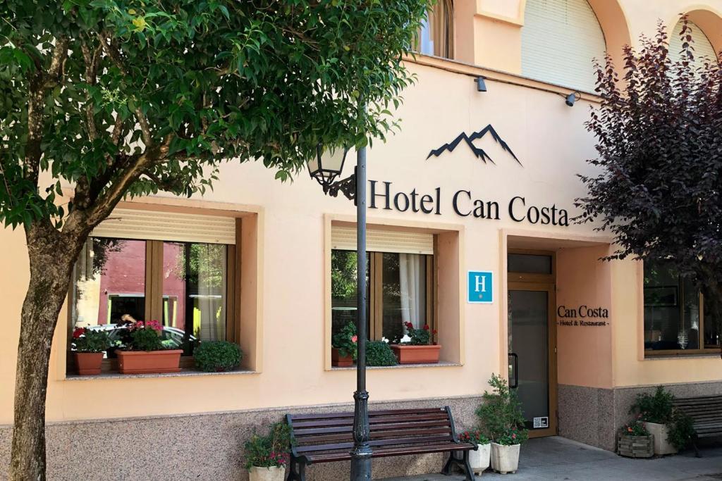 a building with a sign on the front of it at Hotel Costa in El Pont de Suert