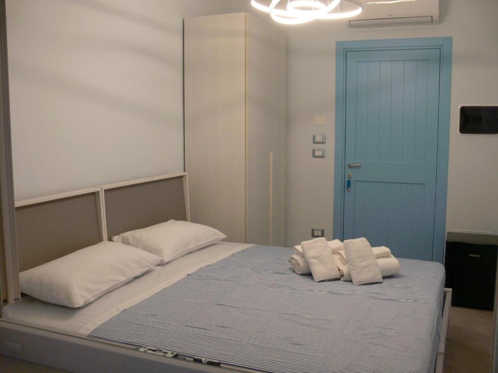 En eller flere senge i et værelse på Tamarix