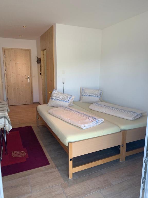 Postel nebo postele na pokoji v ubytování Haus Baracca